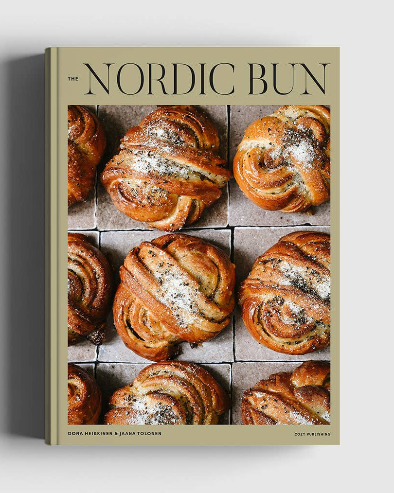 A hardcover book titled 'The Nordic Bun' by Sara Smedberg and Karin Svensson, featuring a cover with a grid of golden-brown baked breads, shown standing upright against a light gray background.